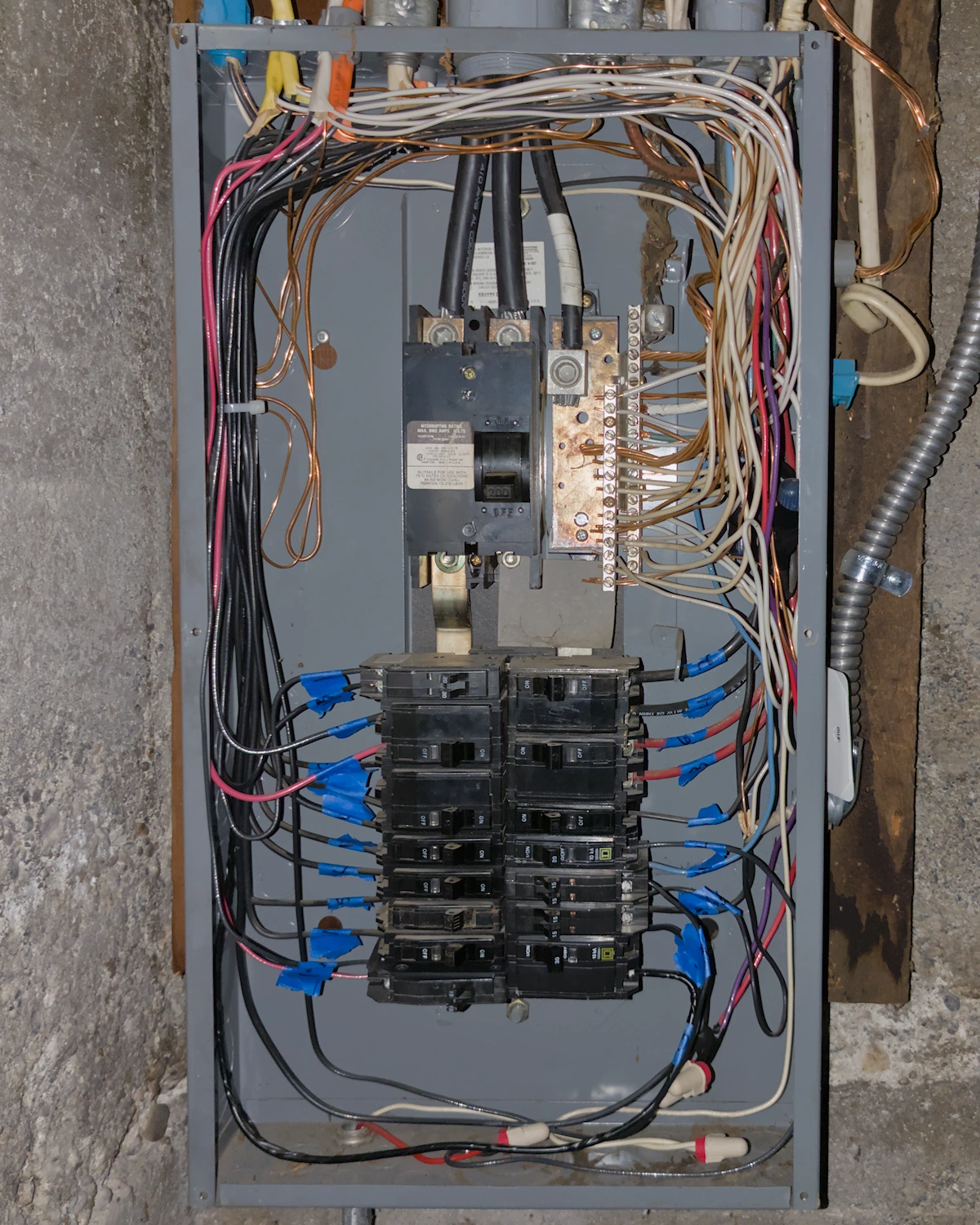 An old grey electrical breaker panel